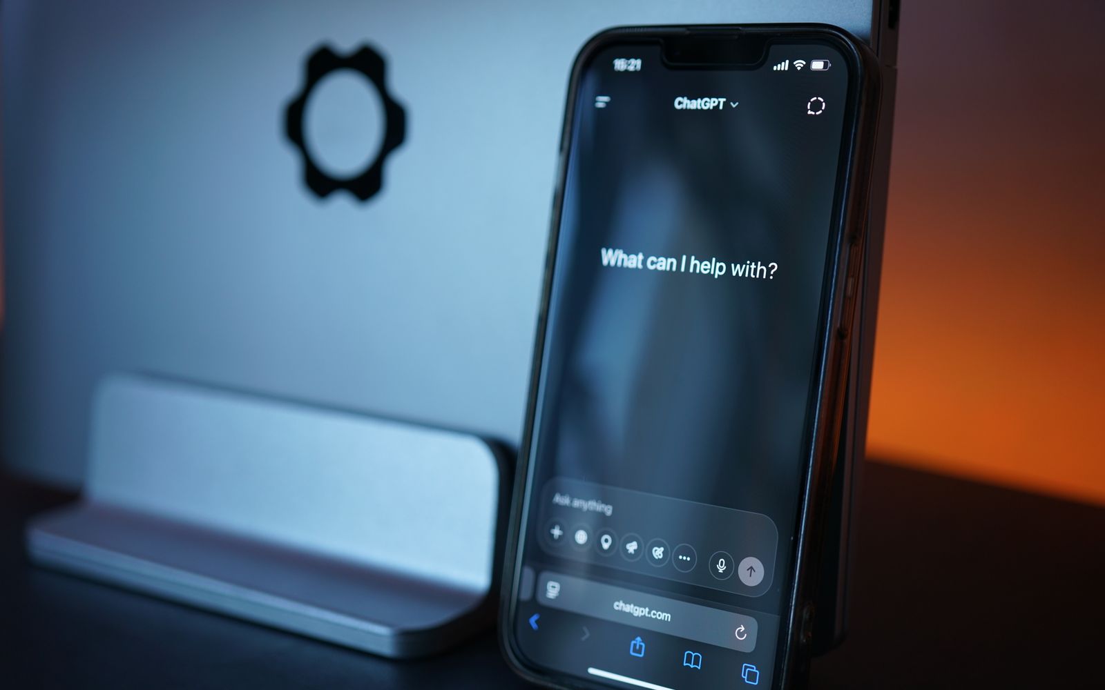 Close-up of a smartphone with AI chat interface, showcasing advanced technology in a sleek design.