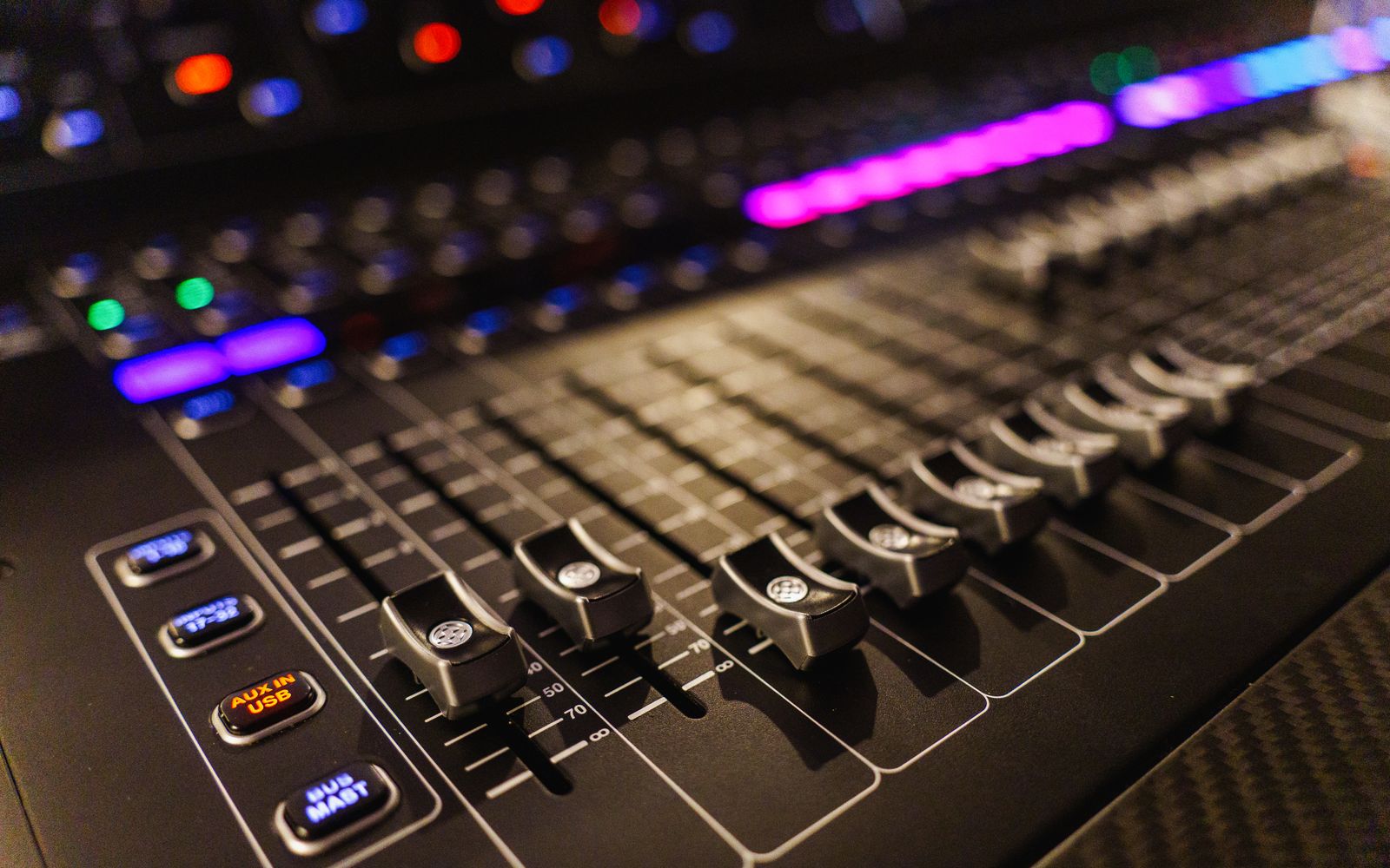 Detailed view of an advanced audio mixing console, perfect for studios.