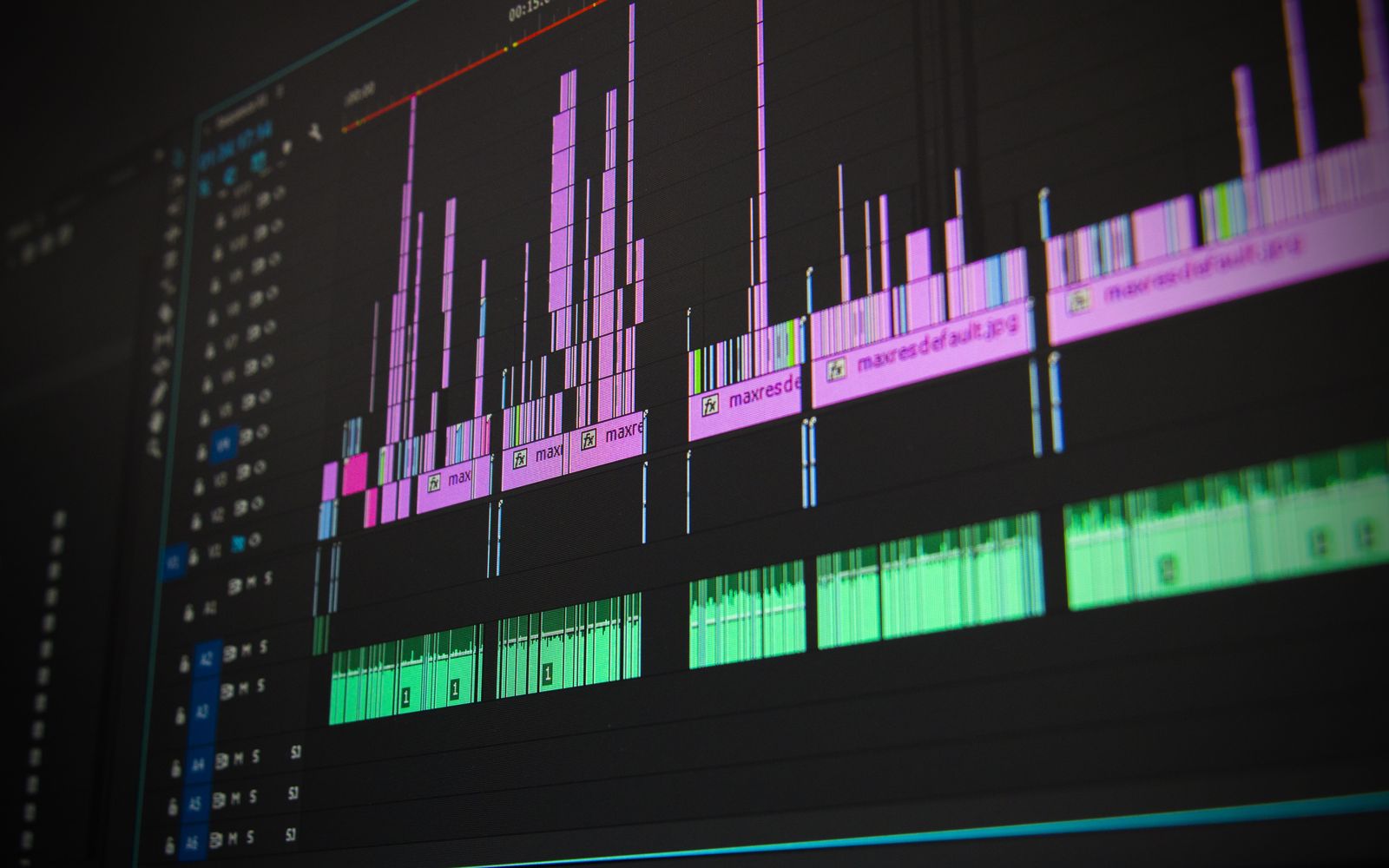 Close-up of a professional audio and video editing software interface with waveform displays.