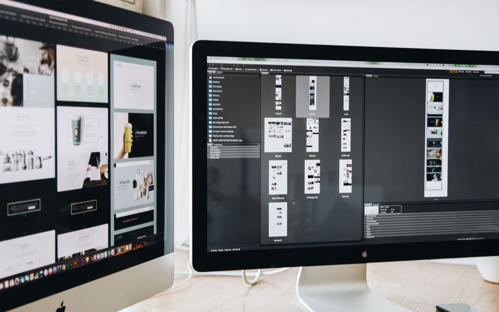 A modern workspace featuring dual computer monitors displaying web design projects, emphasizing technology and productivity.